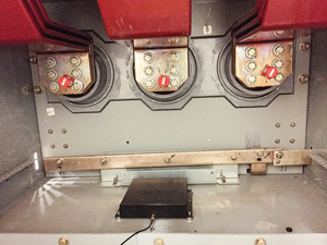 Fig. 3. Three SAW temperature sensors (orange sensors in middle) mounted in MVS.